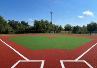 Baseball field built with green and red artificial sports turf